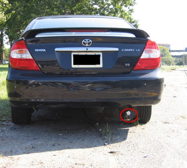 My car. Doesn't look too bad, does it? But what's that in the tailpipe? Note the piece circled in red.