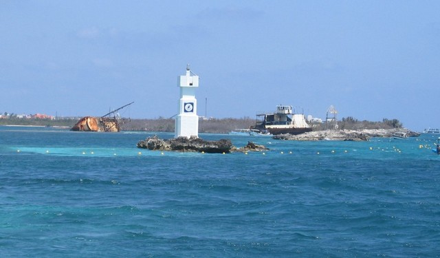 Approaching the pier. A shipwreck from hurrican damage can be seen.